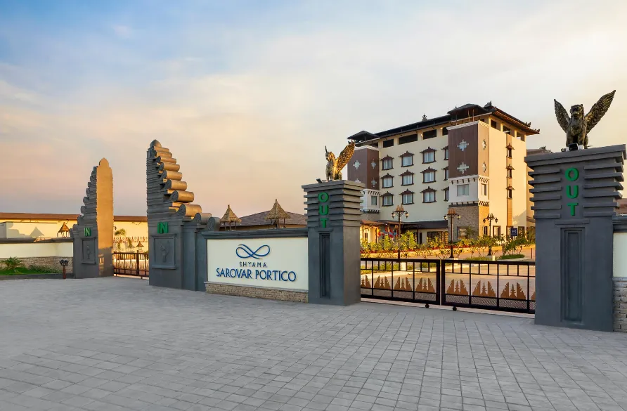 Hotel entrance of Shyama Sarovar Portico Orai displaying exterior façade and driveway access