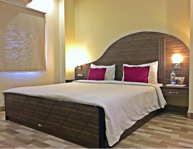 Suite room at Spring Sky by ShriGo Hotels Mughalsarai with separate seating and sleeping space