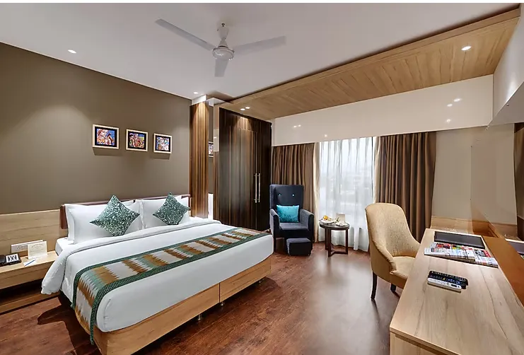 premium room at The Fern Residency Udaipur with expanded floor space and window-facing seating