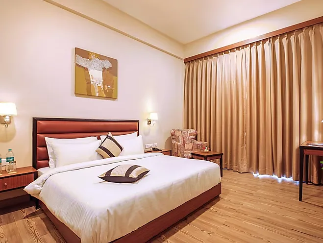 Superior room at The Lalita Grand Mathura showing enhanced furnishings and comfortable layout
