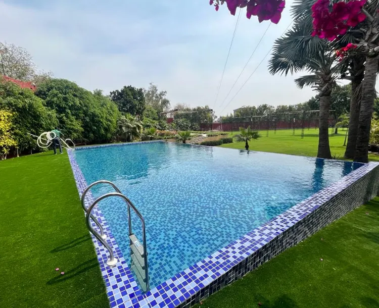 Swimming pool at The Lalita Grand Mathura with pool area and surrounding deck