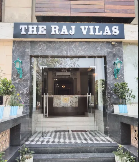 Entrance view of The Raj Vilas Agra showing exterior façade and driveway access