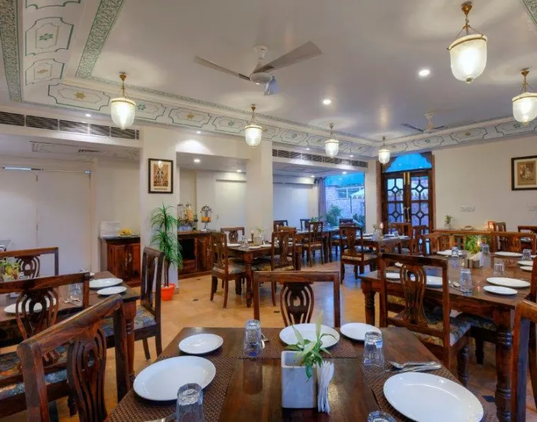 Restaurant at Treehouse Rajbagh Jodhpur with dining tables and relaxed interior setup