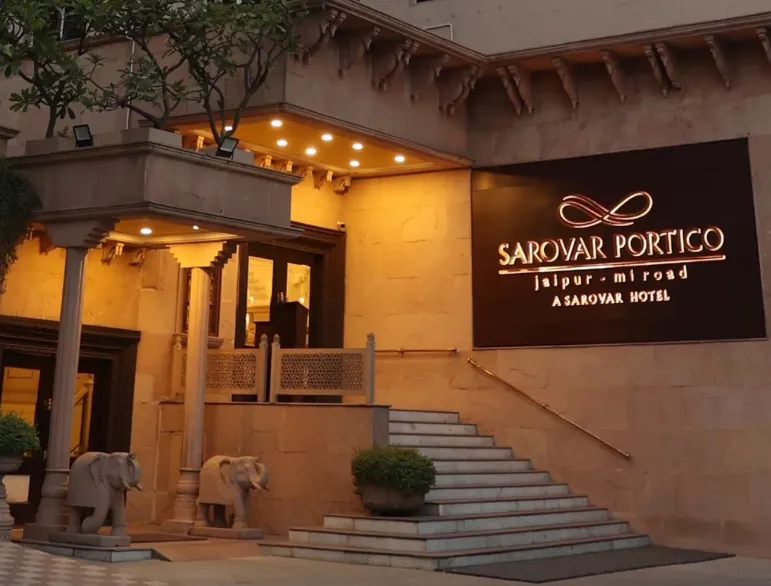 Entrance view of V Sarovar Portico MI Road Jaipur with exterior façade and driveway access