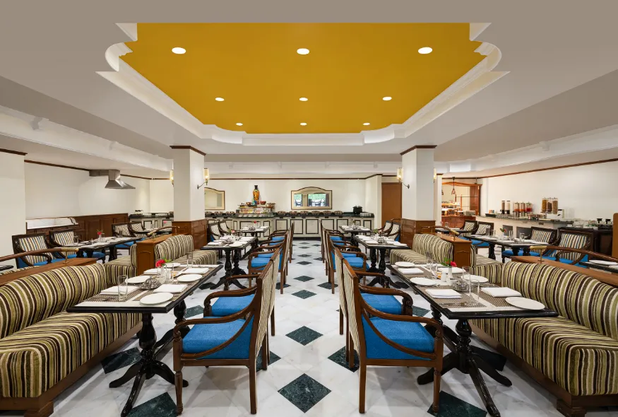 Restaurant at V Sarovar Portico MI Road Jaipur displaying dining tables and interior setup