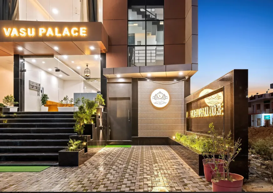 Main entrance of Vasu Palace Ayodhya with exterior façade and access pathway