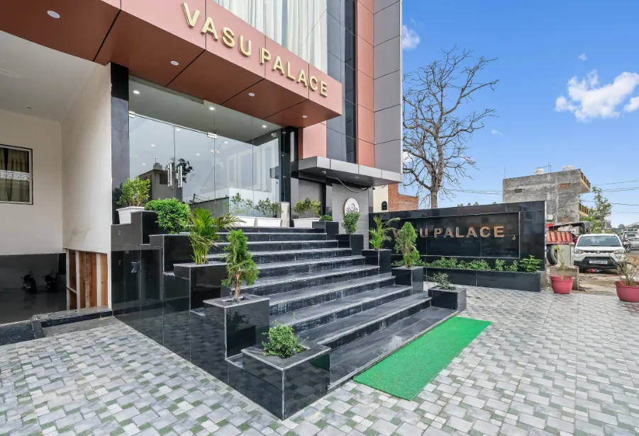 Main entrance of Vasu Palace Ayodhya with exterior façade and access pathway