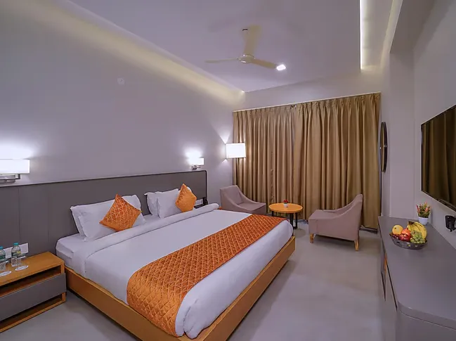 Deluxe room at Wingston A TreeHouse Hotel Barsana Barsana showing spacious layout and upgraded furnishings