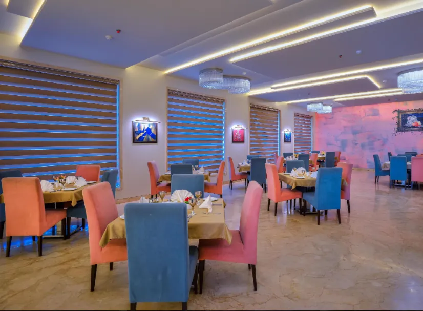 Restaurant at Wingston A TreeHouse Hotel Barsana Barsana displaying dining tables and lighting setup