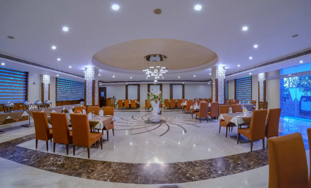 Restaurant at Wingston A TreeHouse Hotel Govardhan Mathura displaying dining setup and lighting