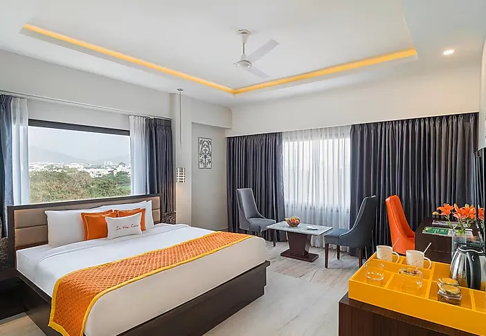 Premium room at Zone Connect by The Park Udaipur showing added seating space and large window view