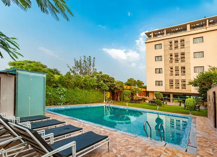 Swimming pool at Zone Connect by The Park Udaipur with poolside deck and surrounding seating