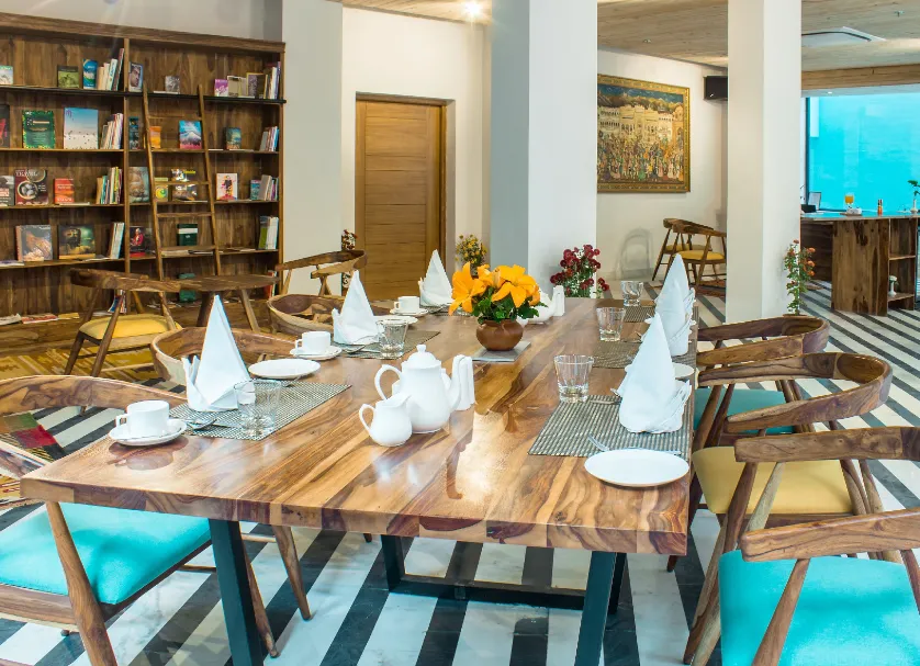 In-house restaurant at Brij Nest Jaipur with dining tables, ambient lighting, and clean interior design