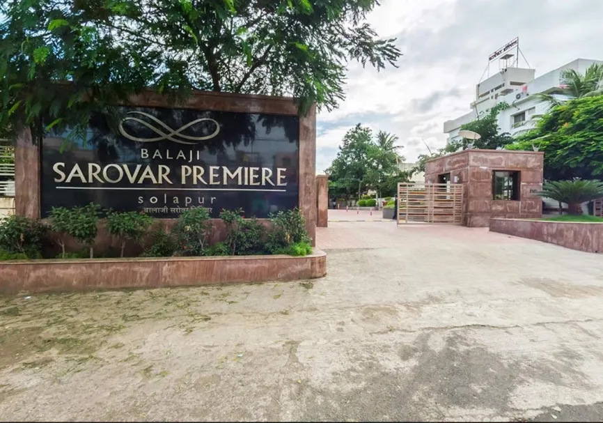 Front entrance of Balaji Sarovar Premiere Solapur with driveway and glass doors