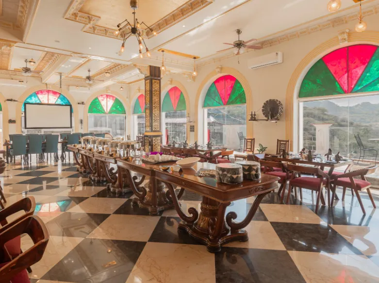 Restaurant at Clarks Resort Ajmer with dining tables and interior décor