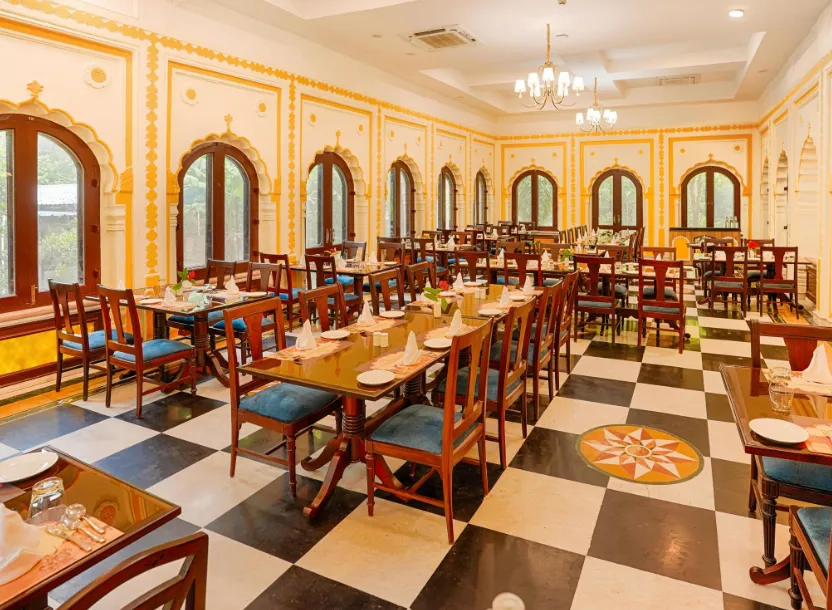 Restaurant at Club Mahindra Bharatpur with arranged dining tables