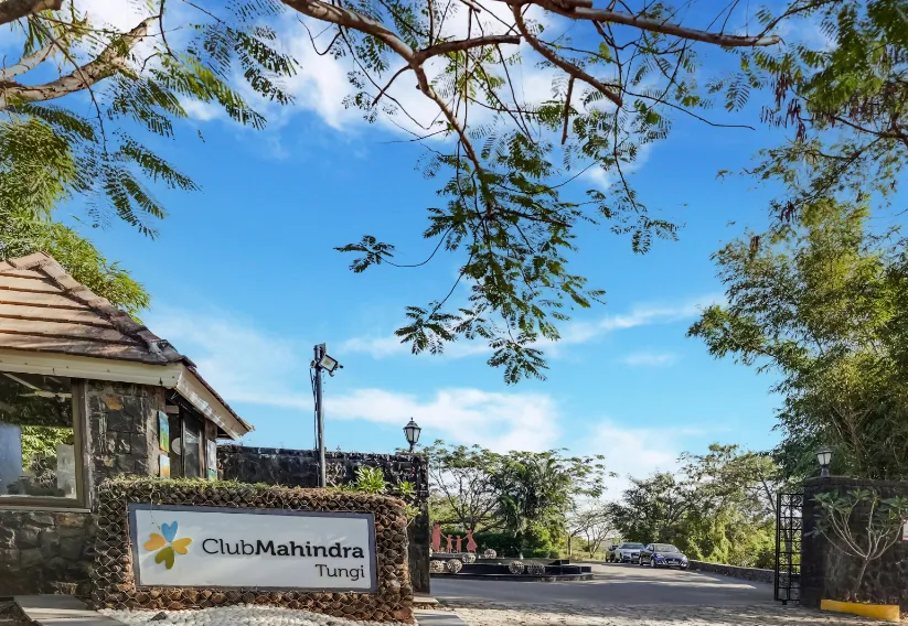 Entrance of Club Mahindra Resort - Tungi Lonavala with hotel façade and greenery