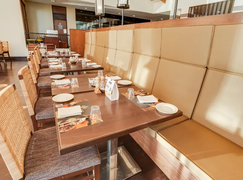 Restaurant at Club Mahindra Resort - Tungi Lonavala with arranged dining tables