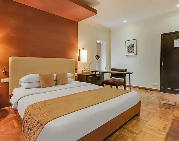 Superior room at Club Mahindra Resort - Tungi Lonavala with bed and interior design