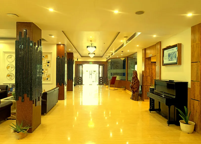 Entrance of Days Hotel by Wyndham Neemrana with hotel façade and driveway