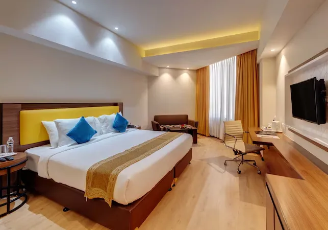 Executive room at Hotel Amarpreet Aurangabad with bed and work desk