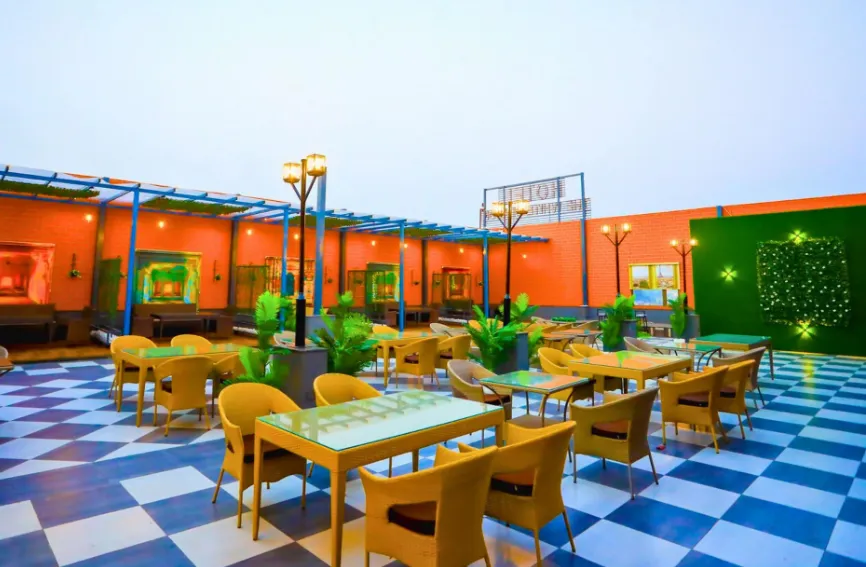 Restaurant at Hotel The White Season Bhilwara with dining tables and interior setting