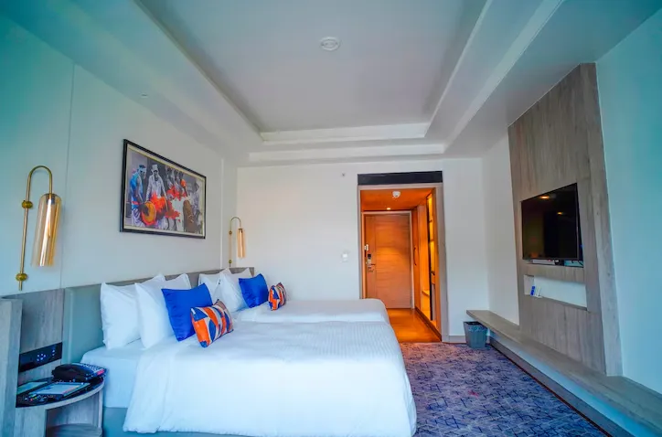 Premium room at Ishaan Sarovar Portico Deoghar with ample space and bed setup