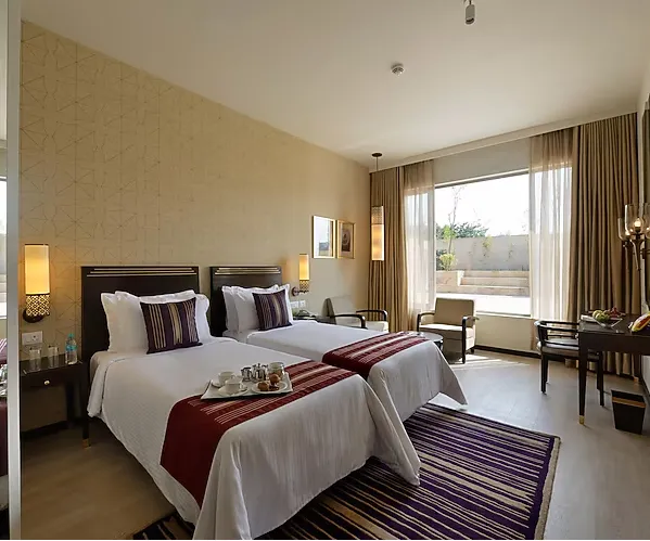 Premium style room at Marasa Sarovar Premiere Tirupati with large bed and seating