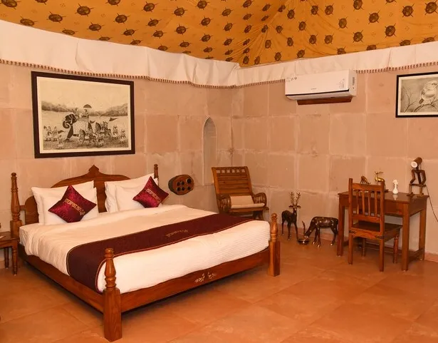 Maharaja Cottage interior at Puratan Qila Ranthambore with separate lounge and sleeping area
