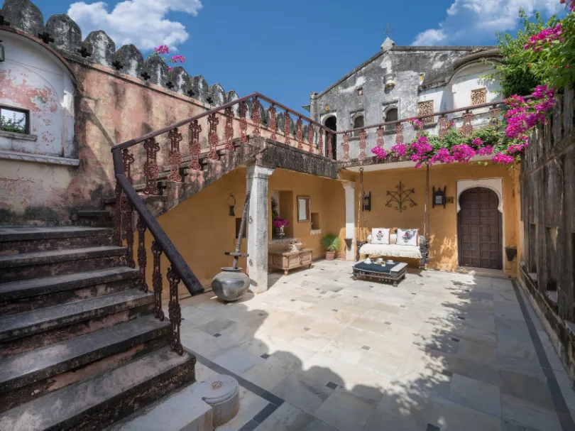 Entrance of Rawla Narlai Luxury Heritage Hotel Kumbhalgarh showing heritage façade and courtyard path