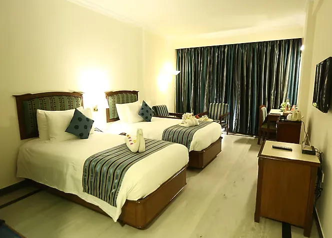 Executive room at Radha Regent Chennai Chennai with ergonomic chair and spacious work desk
