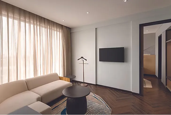 Suite at Ramada Encore By Wyndham Bhiwadi with separate sitting and sleeping space