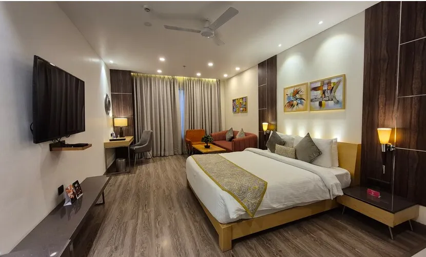Deluxe room at Ramada by Wyndham Ajmer with king bed and room décor