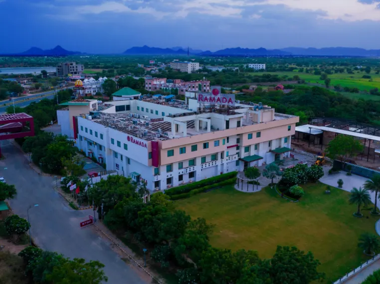 Hotel entrance of Ramada by Wyndham Ajmer with exterior façade and signage