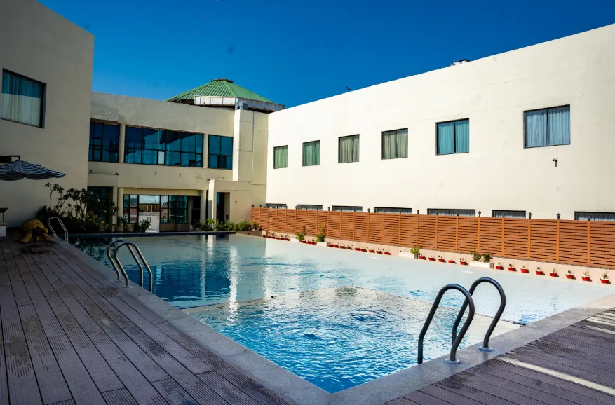 Hotel entrance of Ramada by Wyndham Ajmer with exterior façade and signage