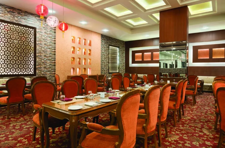 Entrance of Ramada by Wyndham Jamshedpur with hotel façade and signage