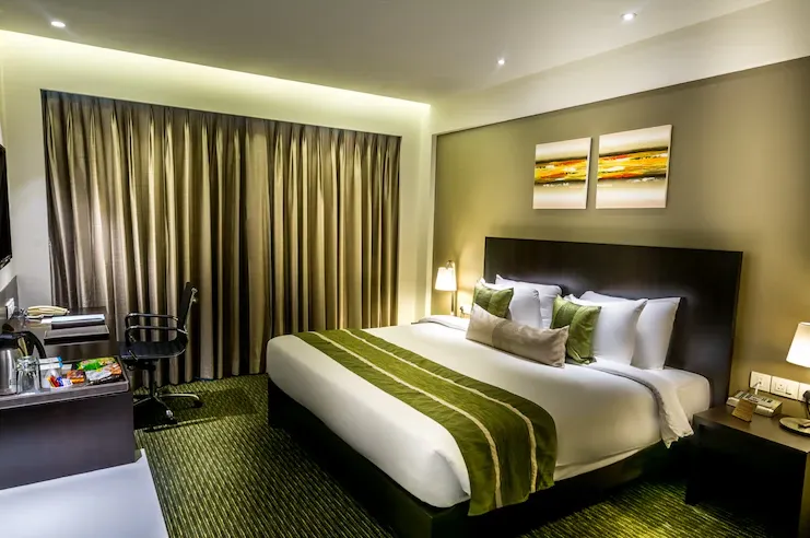 Deluxe room at Rodas An Ecotel Boutique Hotel Powai Mumbai featuring modern décor and seating area