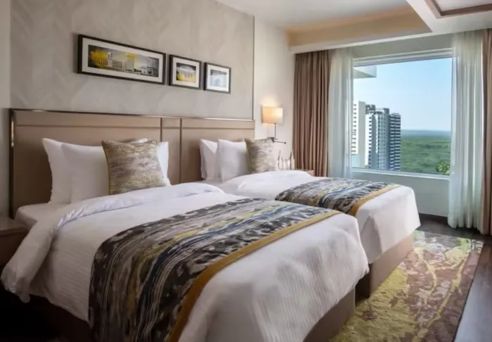 Suite room at Royal Hometel Suites Dahisar featuring separate sitting space