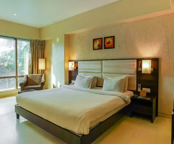 Deluxe room at T2 Beacon Hotel Andheri showing double bed and work desk
