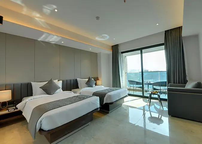 The-Fern-Residency-Bhiwandi-winter-green-room-twinbeds