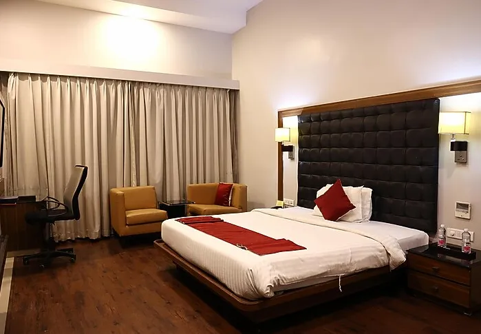 Hazel Suite at The Fern Residency Kakinada showing bedroom and sitting area