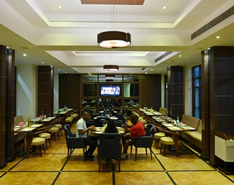 Restaurant at The Fern Residency Kakinada with dining tables and menu setup