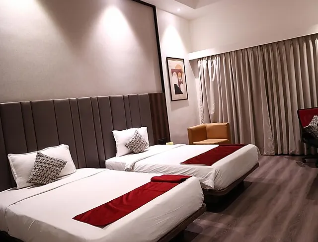 Winter Green Room at The Fern Residency Kakinada with bed and window light