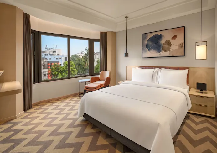 Suite at The Residency Chennai with separate living space and bedroom area