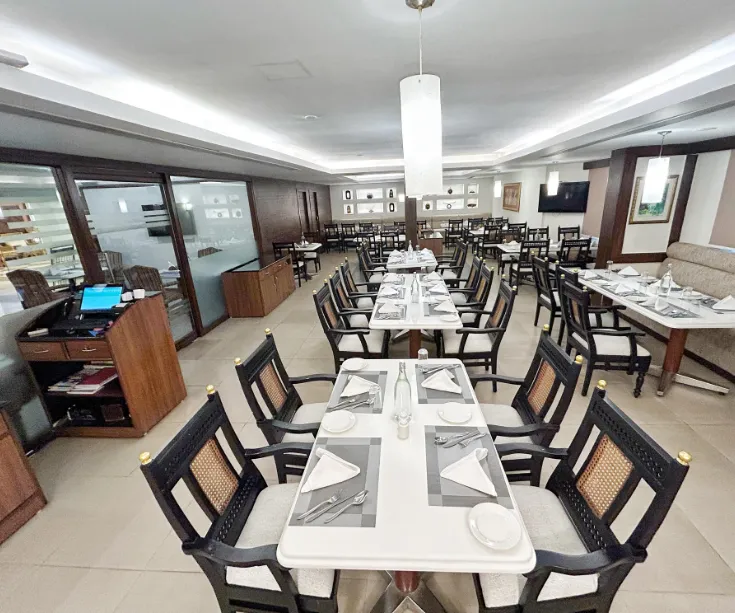 In-house restaurant at The Residency Karur with dining tables and buffet setup