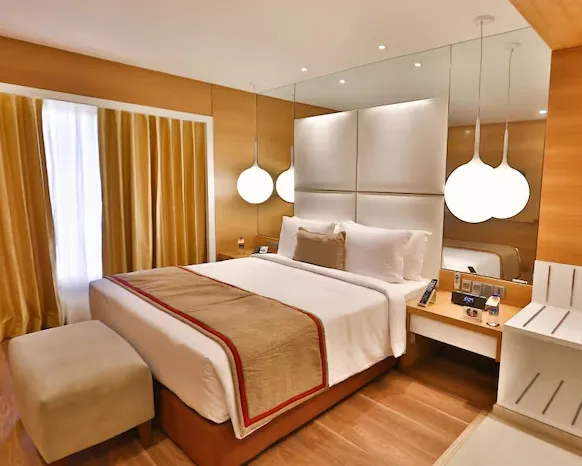 Club suite at The Residency Towers Coimbatore with separate living area and bedroom