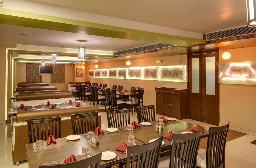 Restaurant at The Royal Melange Beacon Ajmer with dining tables and interior setting