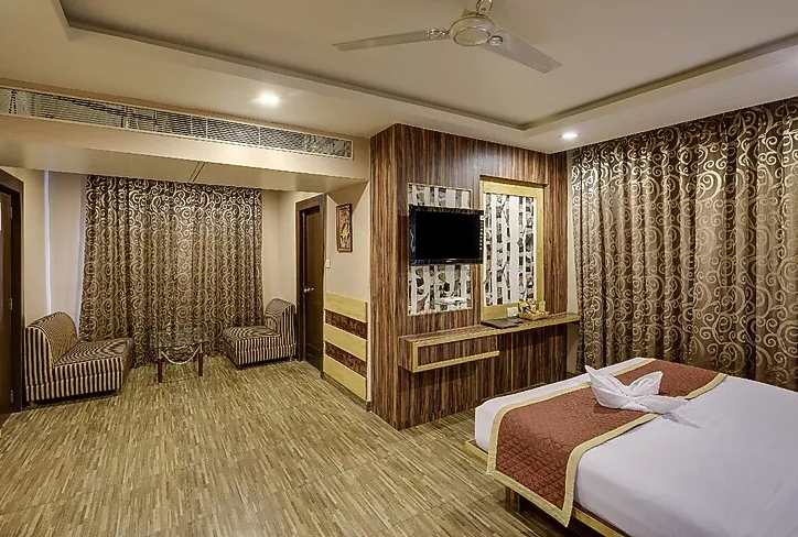 Royal suite at The Royal Melange Beacon Ajmer with bed and separate sitting area