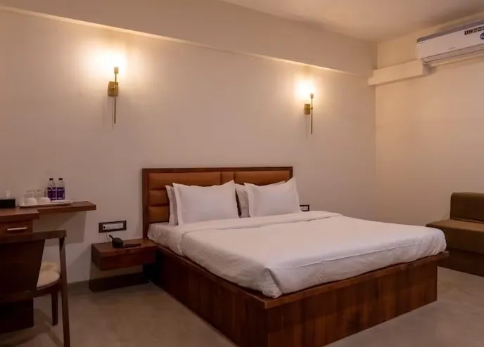 Deluxe room at VITS Select Diveagar Diveagar showing double bed and window