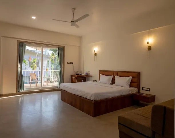 Deluxe room at VITS Select Diveagar Diveagar showing double bed and window